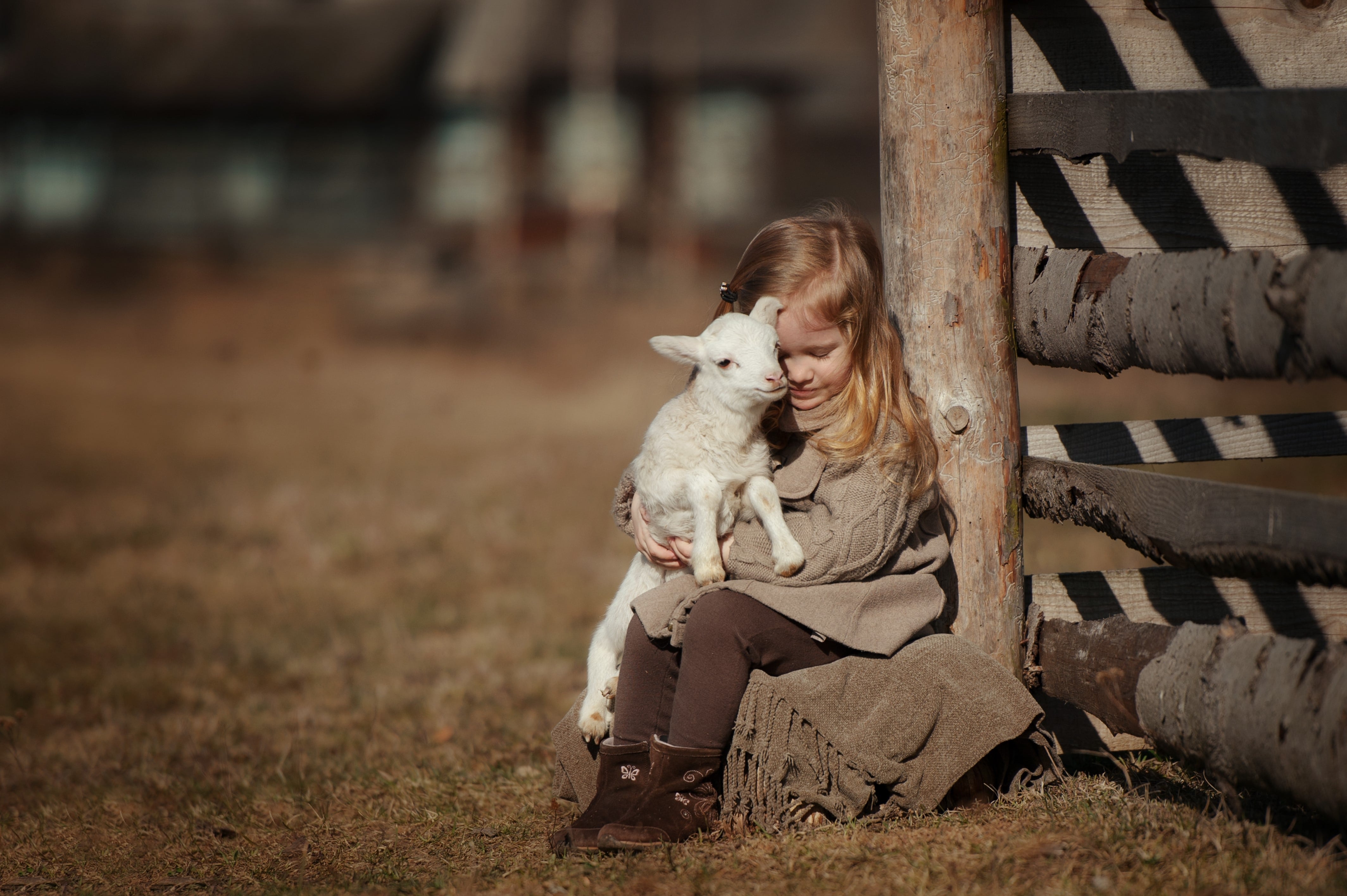 Girl Holding Lamb